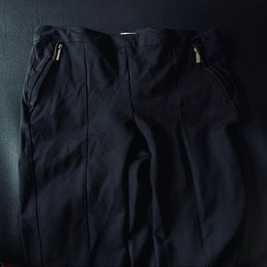 Black skinny pants with gold zippers